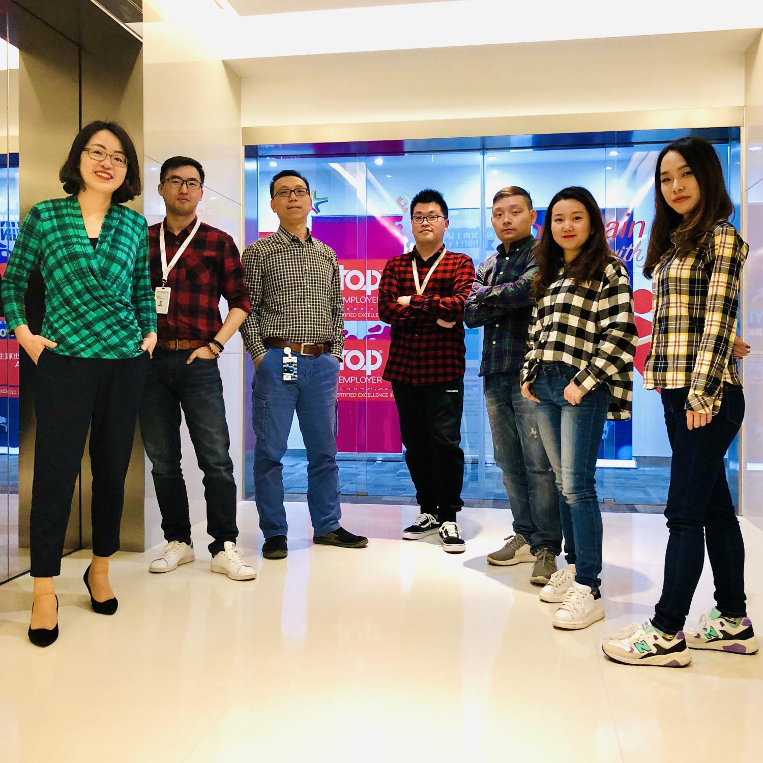 Seven people posing for the camera